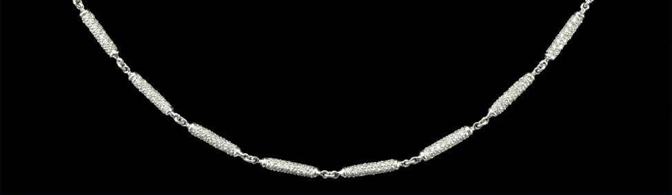 229 A DIAMOND SET BATON-LINK CHAIN, the cylindrical baton links pave set throughout with small brilliant-cut diamonds, to a similarly set cylindrical clasp, mounted in white precious metal, clasp