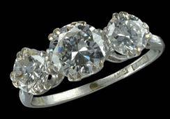 1000-1500 230 A THREE STONE DIAMOND RING, the three brilliant-cut diamonds in eight double claw settings, mounted in white precious metal, shank stamped plat and pt, estimated diamond weights