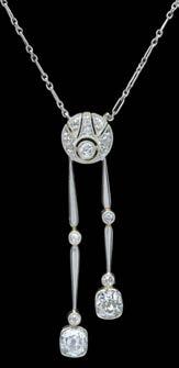 239 AN EARLY 20TH CENTURY DIAMOND NEGLIGEE PENDANT, the central diamond set roundel millegrain edged and suspending two articulated pendant drops below, of uneven length, each pendant