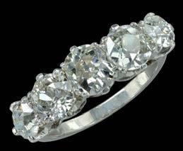 5 carats, with a small rose-cut diamond above, and an old-cut diamond set surmount, on post fittings, total diamond weight approximately 1.25 carats, length 15mm.