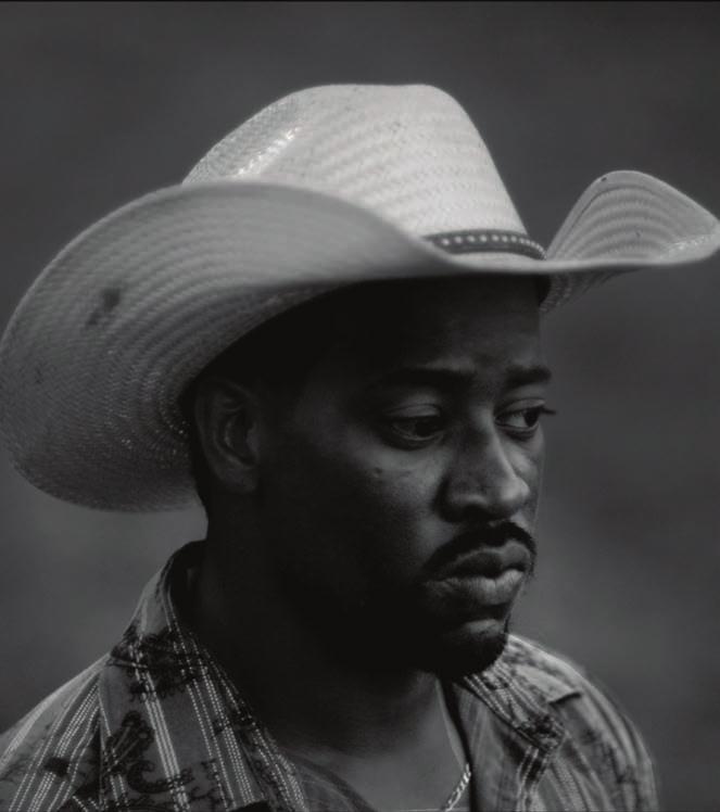 Kahlil Joseph, Wildcat (Aunt Janet), 2016. Video still. Three-channel video installation with dirt from Grayson Rodeo, Oklahoma. B/W HD video. 7' 53".