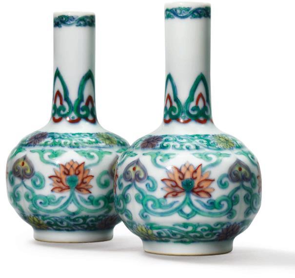 This exquisite pair of vases features the finest materials, extremely accomplished potting, a graceful silhouette and beautifully painted decoration, representing Imperial Yongzheng porcelain of the