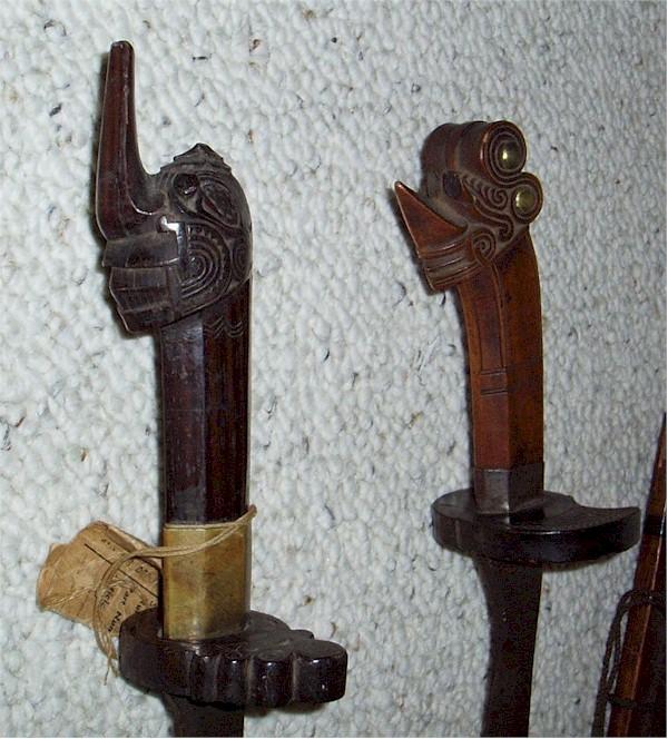 17 Swords 16 and 17- Tenegre Panay, Philippines. Stylized wood handles with carving also on guard. One with brass ferrule the other with iron ferrule.