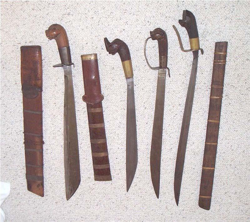 Swords 18, 19, 20, 21- Tenegre / Binangon - Panay, Philippines. Stylized wooden handles with brass, bronze or iron ferrule.
