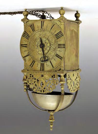 foliate scroll engraving, the chain-driven movement, signed and numbered to the back plate, striking on a coiled gong, in a George III-style bell-top case with leaf-capped carry handle, urn finials,