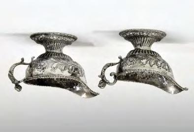 5cm long, weighted 250-350 (+24% BP*) Lot 140 Lot 140 Matched pair of George II/George III silver pedestal cream boats, each having a figural scroll handle, gadrooned