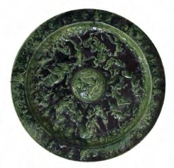 Lot 281 19th Century Continental green glazed majolica plaque, decorated in relief with the Rape Of The