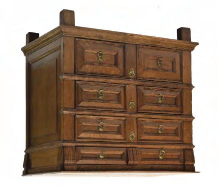 17th Century oak geometric chest of drawers, the moulded two-plank top over incised frieze and four graduated long drawers, each of two panel design with pierced brass escutcheons and ring handles on