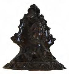 Interesting carved wooden figural wall bracket, probably 18th Century, the three-lobed shelf with foliate palmette edge carving over scroll work framing a bust with shoulder-length
