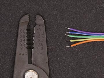 Strip & Tin Jumper Cable Using wire strippers, remove about 5mm of insulation for