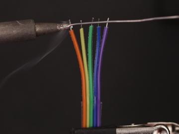 Use a helping third hand to hold wires in place while soldering.