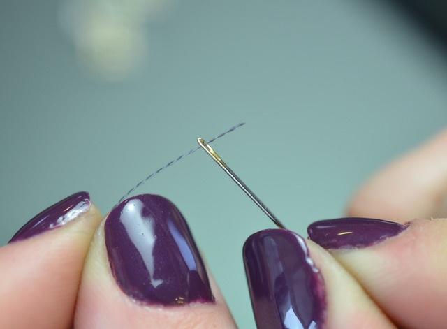 Grab a needle and test it's small enough to pass through the holes in the sequins. Thread up your needle with conductive thread, our 2-ply and 3-ply both are great for this purpose.