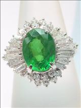 Estimate: $3,300 to $3,800 Lot: 042 A RARE 18K WHITE GOLD FACETED NATURAL GREEN GARNET AND DIAMOND RING 18K 稀有白金刻面青色石榴钻石戒指, 附本地南洋宝石证书 Centre a brilliant faceted oval shaped