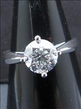 Lot: 098 A 18K WHITE GOLD DIAMOND RING set with a solitaire round diamond weighing 1.