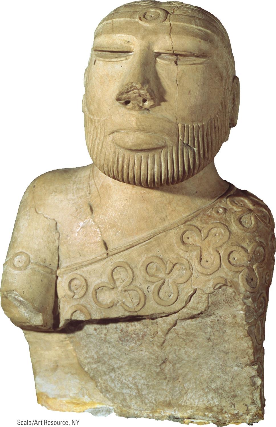 Man from Mohenjo-Daro, circa 2600 1900 B.C.E. This statue of a seated man wearing a cloak and headband was carved from a soft stone called steatite.