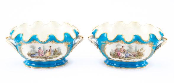 1119 Pair French porcelain monteith bowls 19th century; in the Sevres style, bleu celeste ground, each side with figural and avian reserve decoration, gilding throughout, 5 1/2 in. H., 11 1/4 in. L.