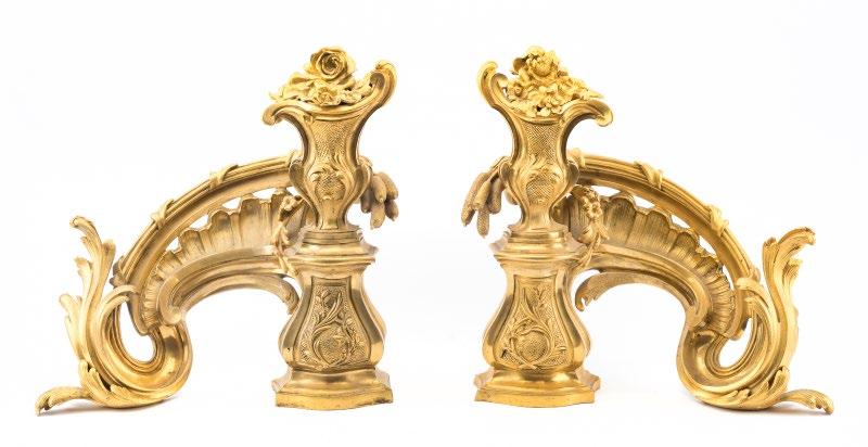 DECORATIVE ARTS 1180 Pair French Louis XV style bronze dore chenets 19th century; pedestal supporting flowering urn and elongated scrolling foliage Est.