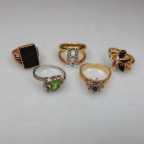 6 184 1 x 9k & 4 x 14k Gold Rings set with onyx, diamonds, a peridot and synthetic