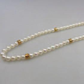 273 Single Strand Freshwater Pearl Necklace with an 18k yellow gold filigree clasp and spacers; with a similar