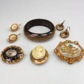 work; a gold-filled brooch and earrings set with lava cameos; a gold-filled