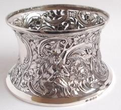 153 159 George V Irish silver dish ring or potato ring pierced and chased with a rural scene containing figures, birds,