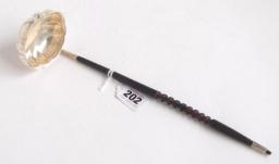 grams 1,000-1,500 Cork silver toddy ladle with scalloped oval