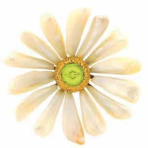 Kaleidoscope This 18K yellow gold necklace features a delicate daisy pendant created from carved mother-of-pearl and a round, faceted zircon.
