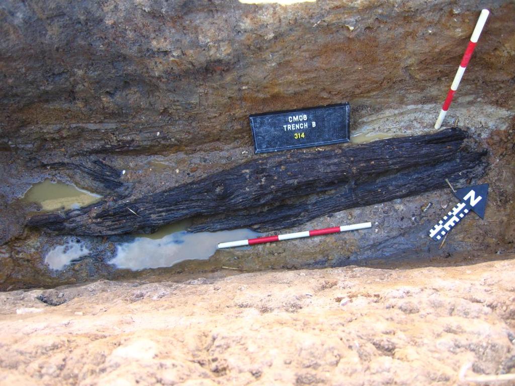 Figure 18: The waterlogged timbers discovered in Context (314) in Trench B. Photo taken by the Author. Whereas the examples shown in (Fig 16+17) are of plank construction.
