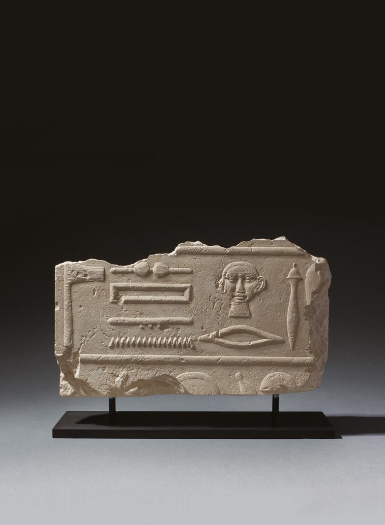 Egyptian hieroglyphic relief fragment Old Kingdom, 4th-6th Dynasty, c.2613-2181 BC Limestone Height 23cm, width 38cm The crisply carved hieroglyphs in raised relief read Master of Secrets.