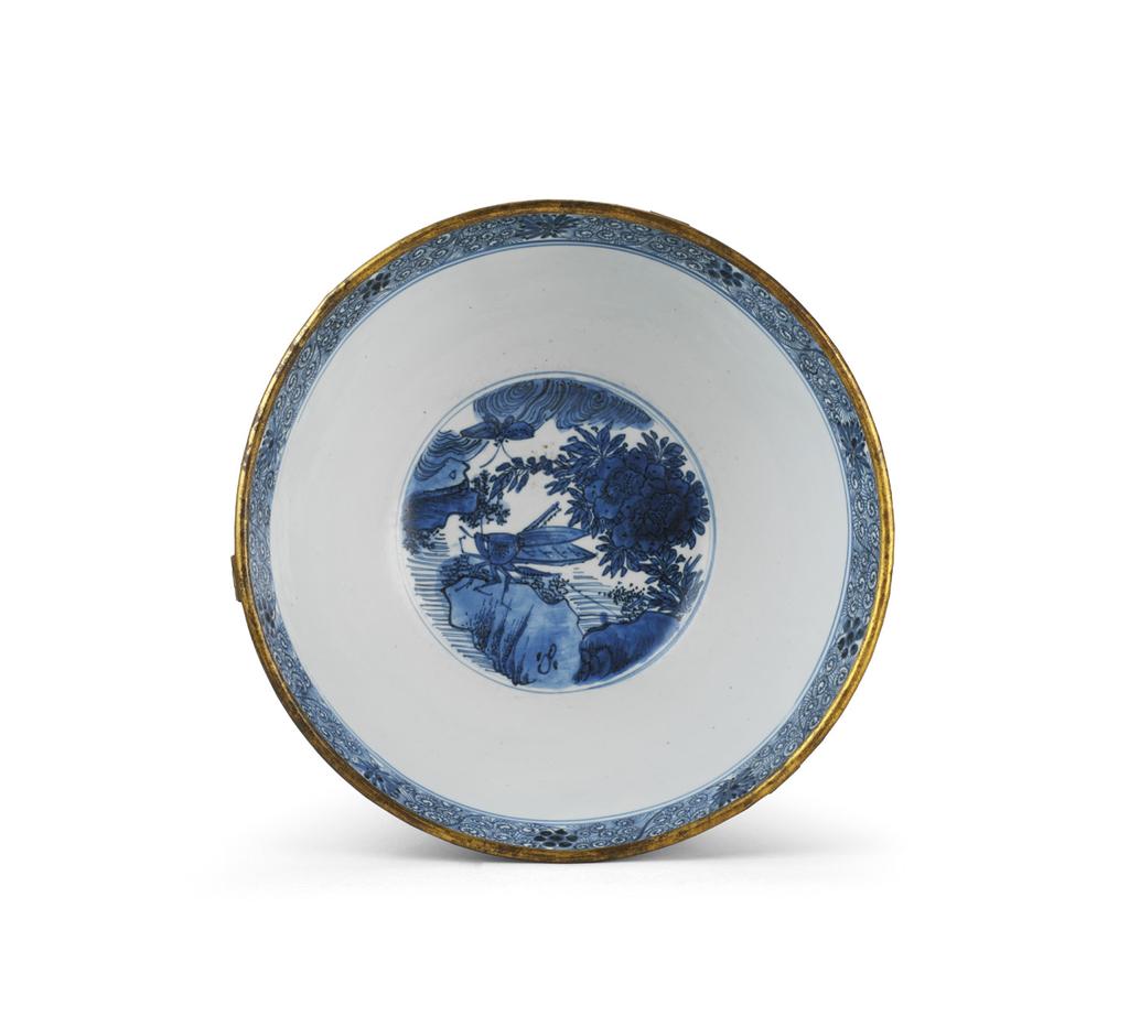 Bowl Porcelain with underglaze cobalt blue and carved decoration Dutch or english gilt copper mount, 7 th century Jingdezhen kilns, Jiangxi province Ming dynasty (368 644), ca. 60 635 H.