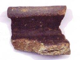 A quantity of tile and fired clay was also recovered. The fired clay comprised small, amorphously shaped pieces containing sand, with holes denoting burnt-out vegetable matter.