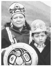This photograph shows Tlingit Indians in traditional dress. northwest coast.