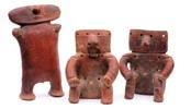 figures of typical slab form, one with guilt metal nose ring, 26cm, 20cm