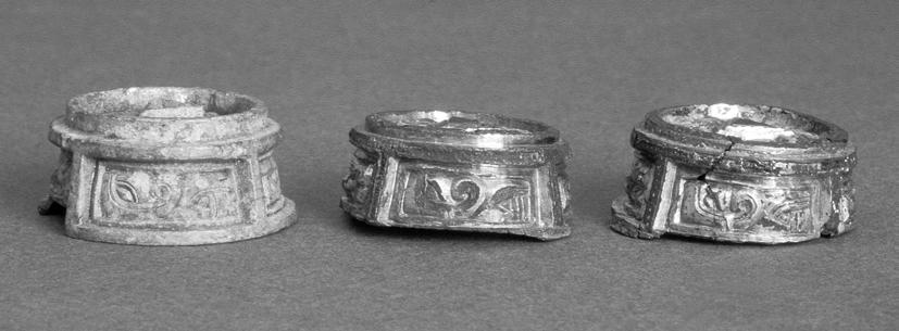Fig. 7. Gilded clasp-buttons from Nicktuna and unfinished button from Helgö with equivalent mould fragments. Photo ATA.