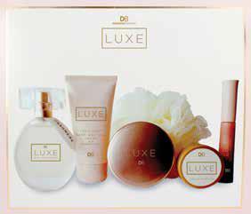 hand and body lotion, compact mirror, perfume balm for on-the-go application, a body loofah and clear lip gloss.