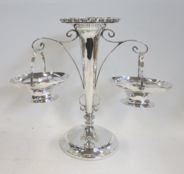 A Victorian silver swing handled Sugar Basket. Mark of Harrison Bros and Hanson, Sheffield, 1882. Part fluted with reeded border 11.5 cms wide, 4.5 oz (145 gr) 70-100 132.