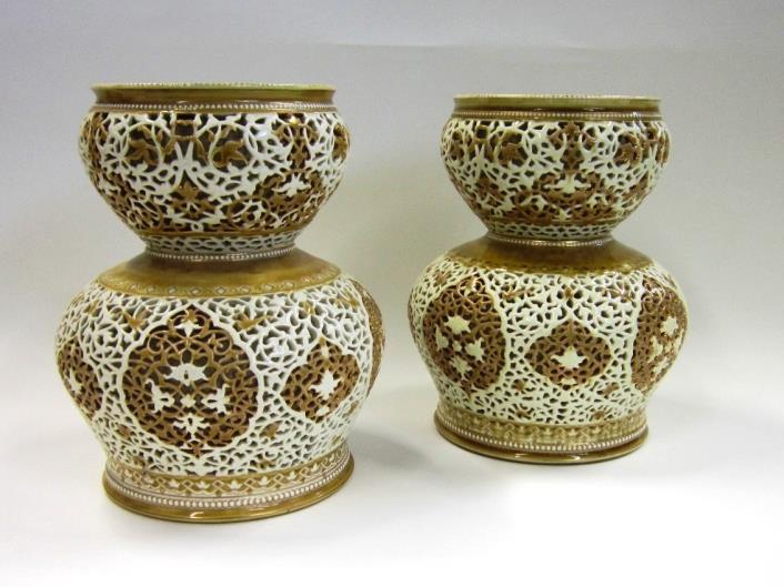 20.5 cms high 25-40 Lot 280 280. A pair of Zsolnay Pecs reticulated and double walled Vases. Impressed and gold painted mark and '2685' to base. 25.5 cms high. (One with crazing and crack to interior wall) 150-250 281.