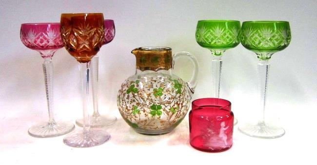 Three 19th Century glass Decanters, one plain with three ring neck; another faceted with step cut shoulder and neck; and one faceted with three ring neck (3). The largest 26 cms high 322.