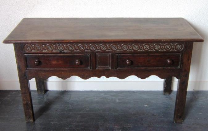 A Georgian rectangular oak Dresser Base, the two short drawers with shaped apron below and raised on four squared supports, width 138 cms 150-250 Lot 472 472.