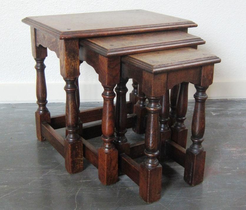 Lot 504 504. A Nest of three oak Occasional Tables on turned supports, the largest width 52 cms 30-40 505.