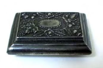 Coffin type snuffbox c1830 with cast decorated lid comprising central oval surrounded by roses, thistles, grapes and leaves. In excellent condition, with working hinge and lid that closes properly.