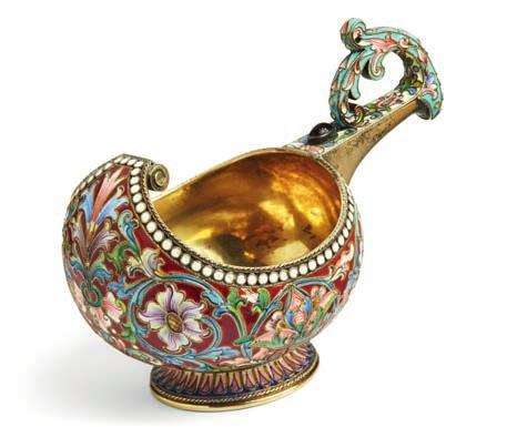 773 NICOLAI VASILIEVICH ALEXEEV, MOSCOW 1896-1908 A Russian silver-gilt and cloisonné enamel kovsh, of oval form with a bow shaped handle and raised prow, decorated with shadowed scrolling flowers