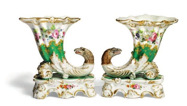 842 842 RUSSIAN PORCELAIN MANUFACTORY, 19TH CENTURY A pair of Russian porcelain vases, of cornucopian form, decorated with eagle heads, flowers, foliage and rocailles in colours and gold on white