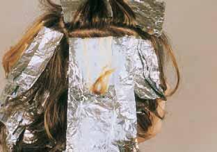 21 In this foil, the virgin hair is all bleached with a small section of previously bleached hair avoided.