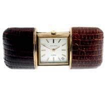 418 419 420 A purse watch by Mappin. Gold plated case with brown leatherette sliding case. Manual wind movement.
