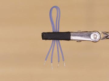 insulation from the tips of each wire using wire strippers.
