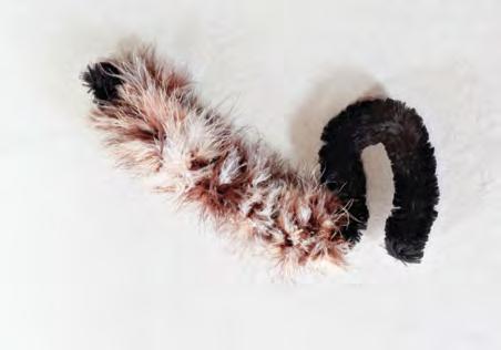 Lynx Tail What You ll Need: giant chenille pipe cleaner (black) feather boa (brown and beige mixed) mini hot glue gun and glue sticks scissors Steps 1.