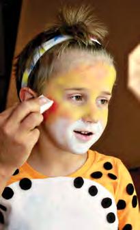 Then use a paintbrush to paint a circle from the nose, around the mouth, and to the bottom of the chin. 2. Next, use a different cosmetic sponge to add orange to the top of the face.