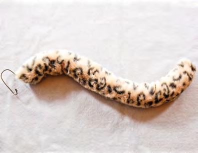 Cheetah Tail What You ll Need: wire hanger polyester stuffing furry cheetah fabric (8 x 27 inch rectangle) stapler knitting needle or stick (optional) scissors Try This!