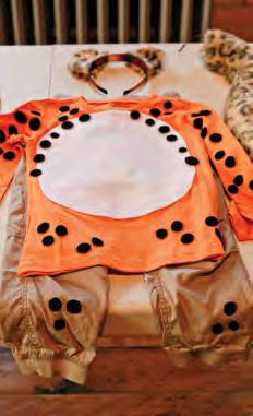 Cheetah Body What You ll Need: black felt (two 9 x 12 inch pieces) white felt (one 9 x 12 inch piece) permanent double-stick tape scissors orange shirt (it can have a picture on the front) tan pants